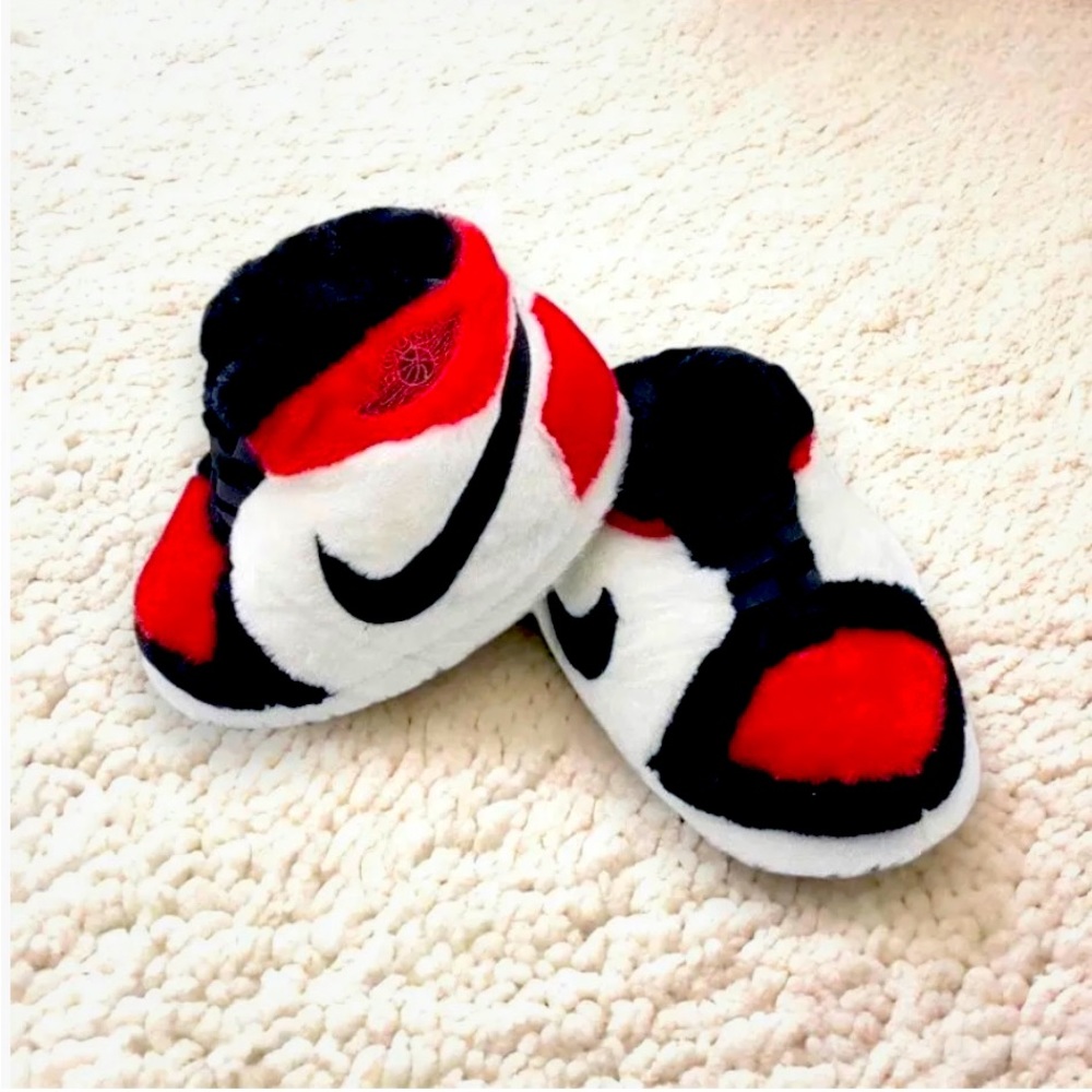 Jordan fuzzy slippers, fits any size!  These are super trendy and hard to find.
